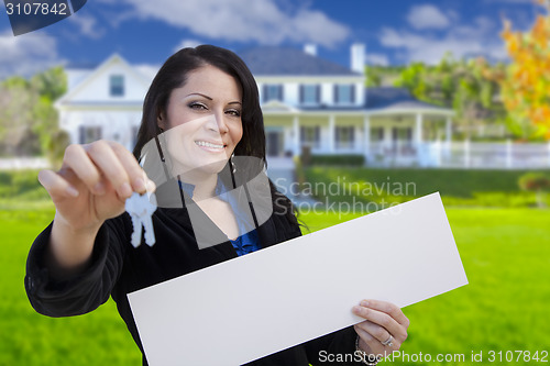 Image of Woman Holding Blank Sign and Keys In Front of House