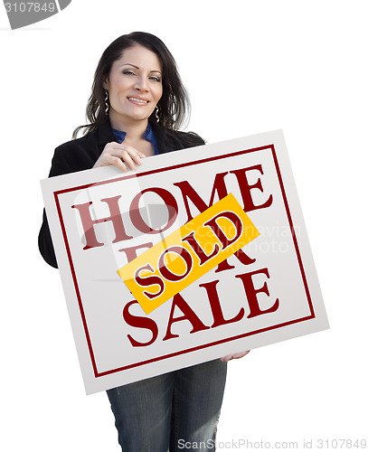 Image of Hispanic Woman Holding Sold Home For Sale Sign on White