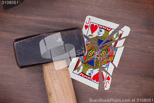 Image of Hammer with a broken card, jack of hearts