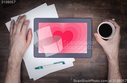 Image of Heart shape backgound on tablet