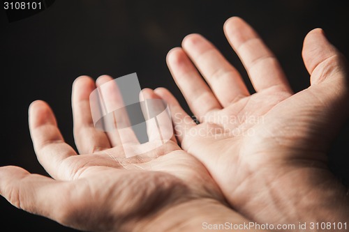 Image of hands begging 