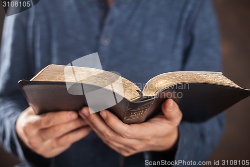 Image of Man reading the holy bible