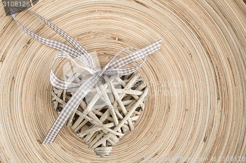 Image of valentine's wooden hearts on a wooden background in retro color