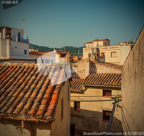 Image of Tossa de Mar, Catalonia, Spain, 06.17.2013, roofs of houses in t