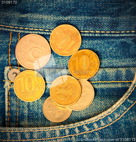 Image of Coins and pocket jeans