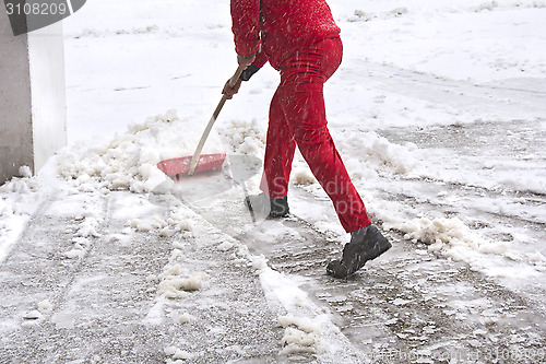 Image of Worker removes snow