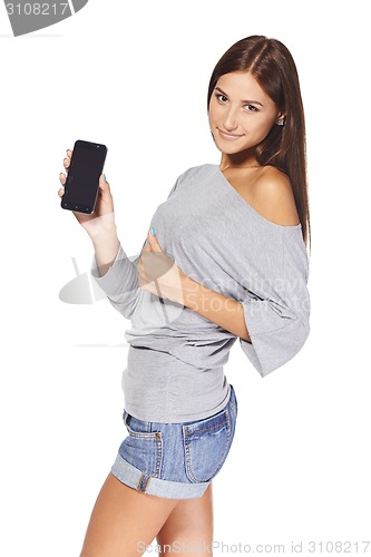 Image of Young woman showing mobile cell phone