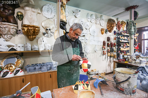 Image of Man making carnival mask