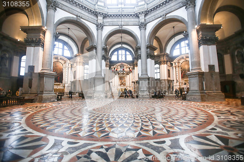 Image of People sightseeing interior of Santa Maria della Salute in Venic