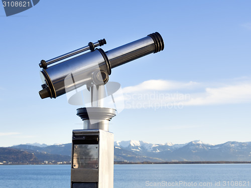 Image of telescope with alps