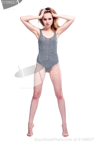 Image of Attractive young woman in gymnastic suit