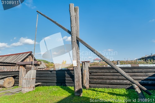 Image of Old wooden water crane well in village