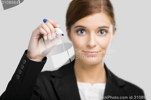 Image of Businesswoman drawing on a glass board