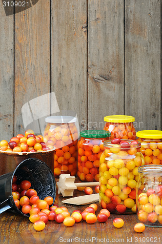 Image of Preserving Mirabelle plums - jars of homemade fruit preserves - Mirabelle prune