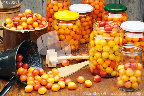 Image of Preserving Mirabelle plums - jars of homemade fruit preserves - Mirabelle prune