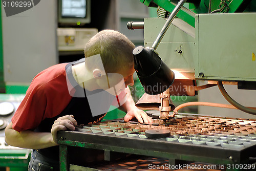 Image of Milling-machine operator works at machine