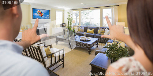 Image of Young Couple Framing Hands of Home Interior