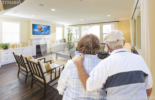 Image of Senior Couple Overlooking A Beautiful Living Room