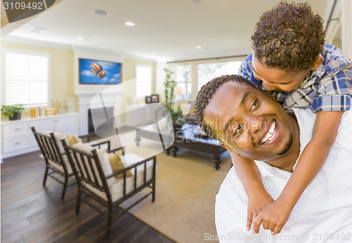 Image of Afrian American Father and Mixed Race Son in Living Room