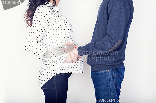 Image of Pregnant mother and happy father