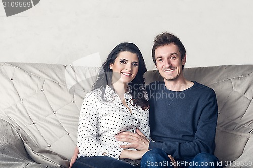 Image of Pregnant mother and happy father