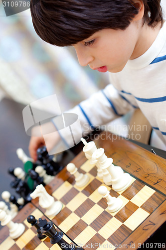 Image of boy and chess