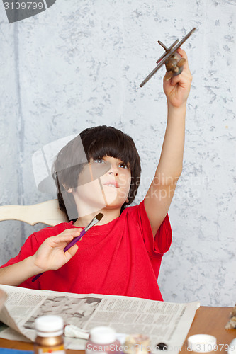 Image of boy and plane