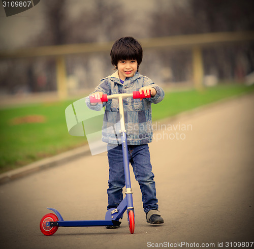 Image of boy with scooter