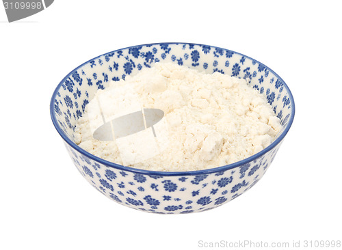 Image of All purpose flour in a blue and white china bowl