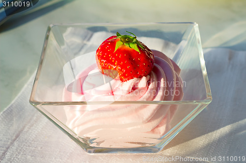 Image of Dessert: cream soufflé and strawberries.