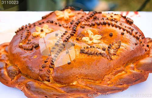 Image of Beautiful cake on a white towel. Sold at the fair.