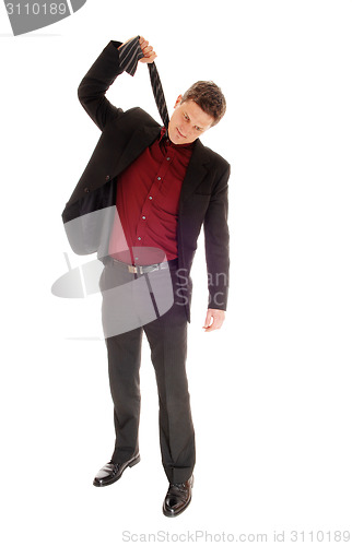 Image of Man pulling his tie.