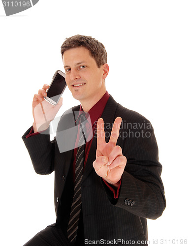 Image of Man holding cell phone.