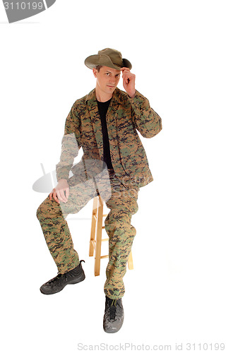 Image of Sitting soldier relaxed.