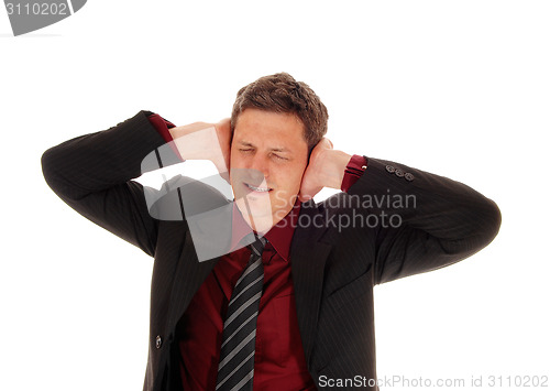 Image of Man covering his ear's.
