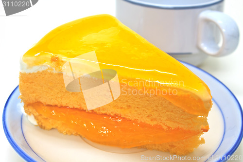Image of  Orange Cheesecake in plate on background