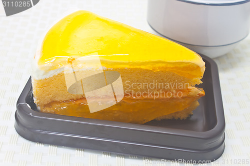 Image of Orange Cheesecake in plate on background