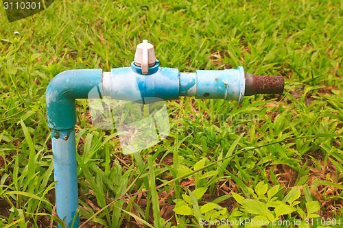 Image of old and rusty faucet 