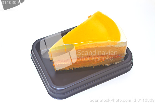 Image of  Orange Cheesecake in plate on background