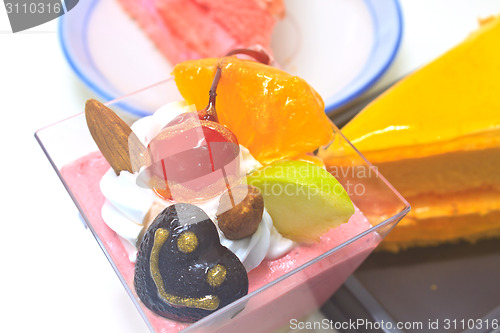 Image of Cupcake with Orange Cheesecake and Strawberry cheesecake