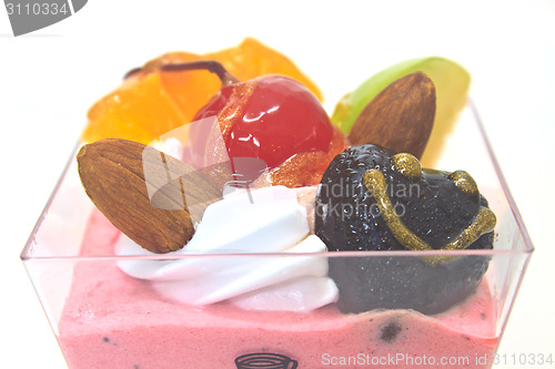 Image of cupcake with cream and fruits