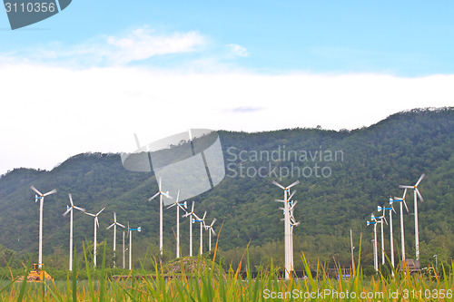 Image of Wind turbines on a farm