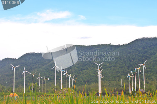 Image of Wind turbines on a farm
