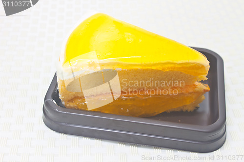 Image of Orange Cheesecake in plate on background