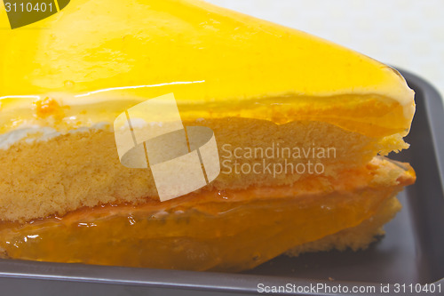 Image of Orange Cheesecake in plate on background