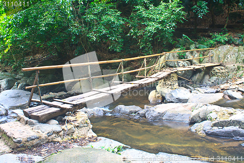 Image of wooden bridge over the stream