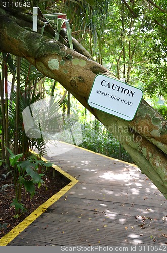Image of Caution sign of mind your head in the garden 