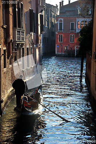 Image of Gondolier in the channel in Venice