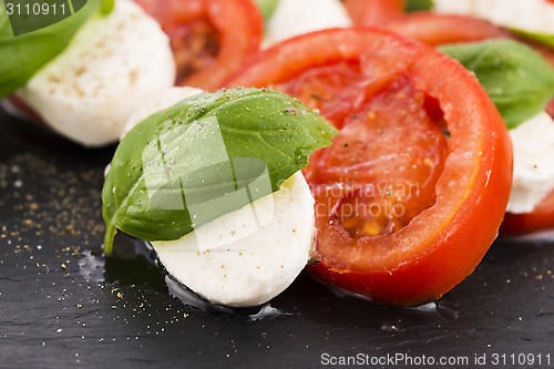 Image of Caprese salad with mozzarella, tomato, basil and balsamic vinega