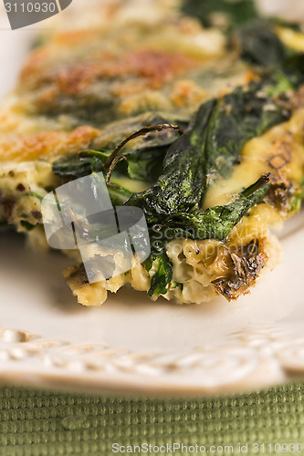 Image of Omelet with vegetables and cheese. Frittata